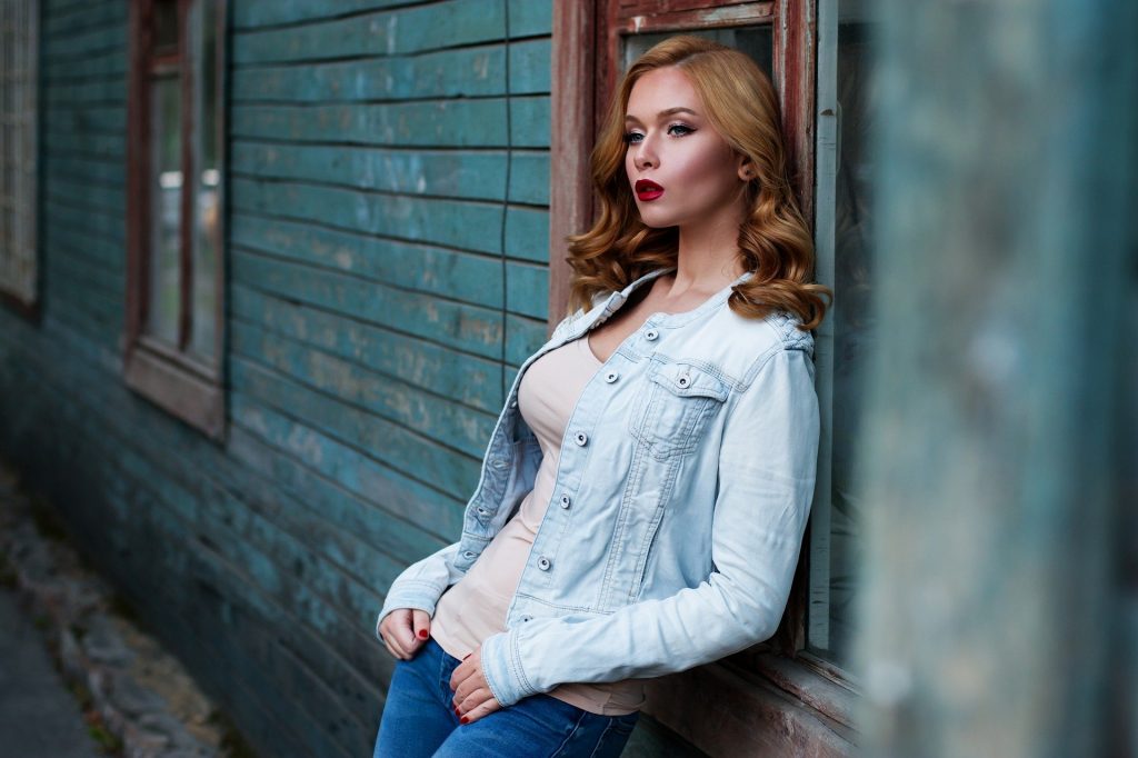 A woman standing in front of a building