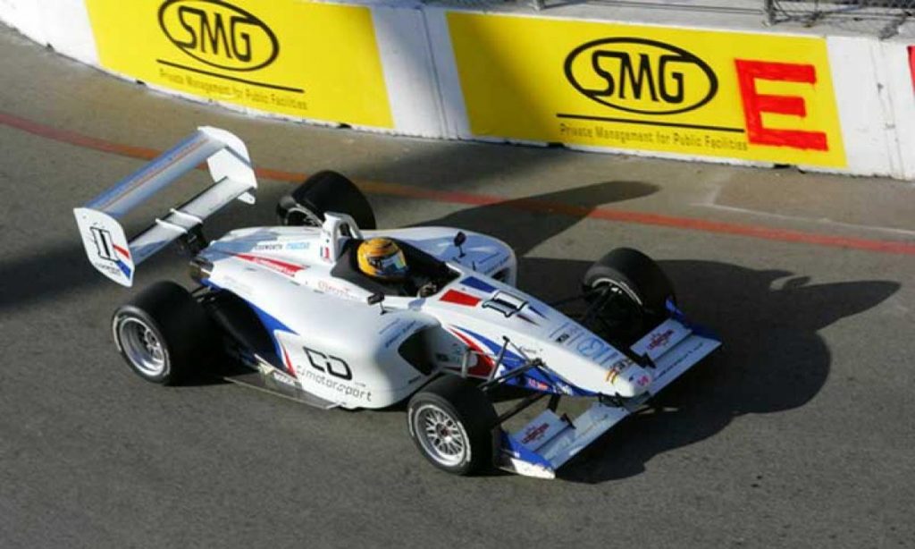 A fighter jet sitting on top of a car